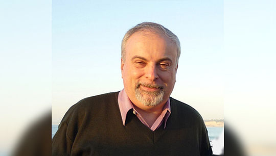 Михаил Волков — главный научный сотрудник лаборатории комбинаторной алгебры и заведующий кафедрой алгебры и дискретной математики ИМКН 